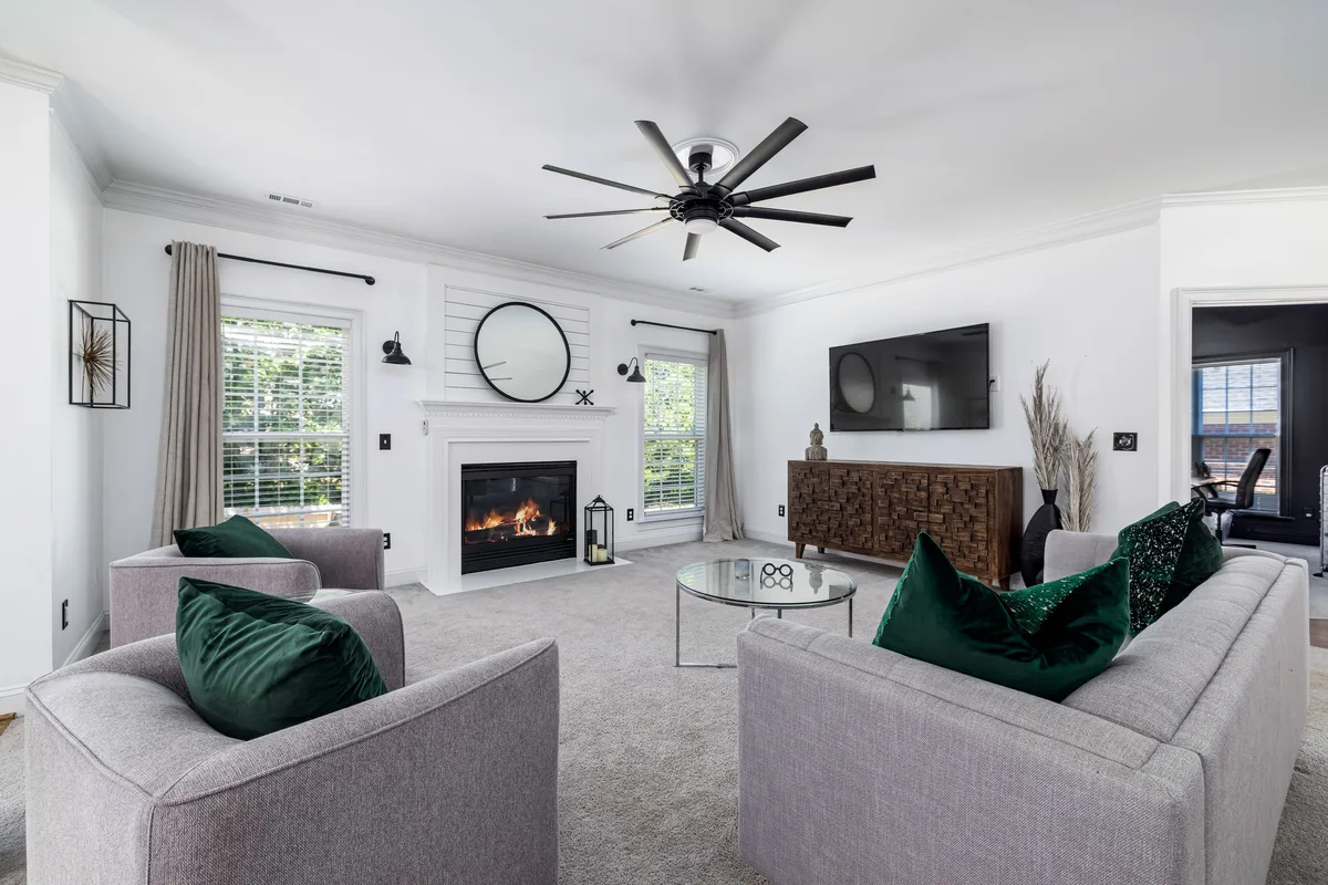 Grey fitted carpet in a bright furnished living room