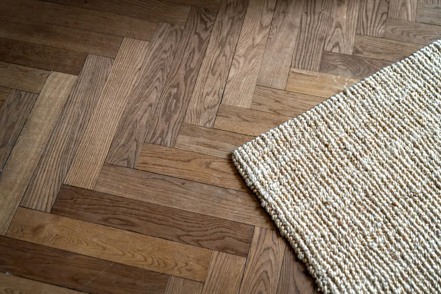 Wood-look LVT flooring with a textured rug
